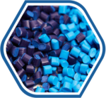 Close-up of blue and dark purple plastic & rubber pellets used as industrial raw material supplies.