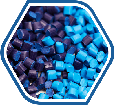 Close-up of blue and dark purple plastic & rubber pellets used as industrial raw material supplies.